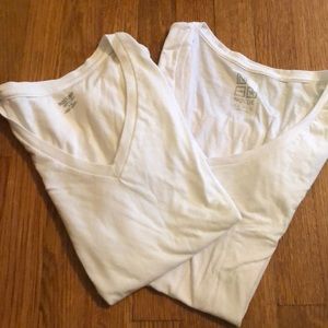 Two white V necks